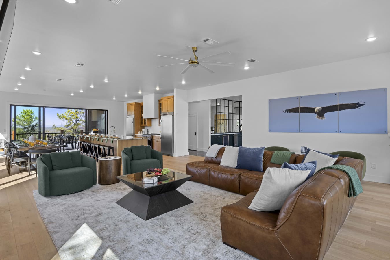 The leather sectional and those green swivel chairs make this living room perfect for spreading out with your crew.