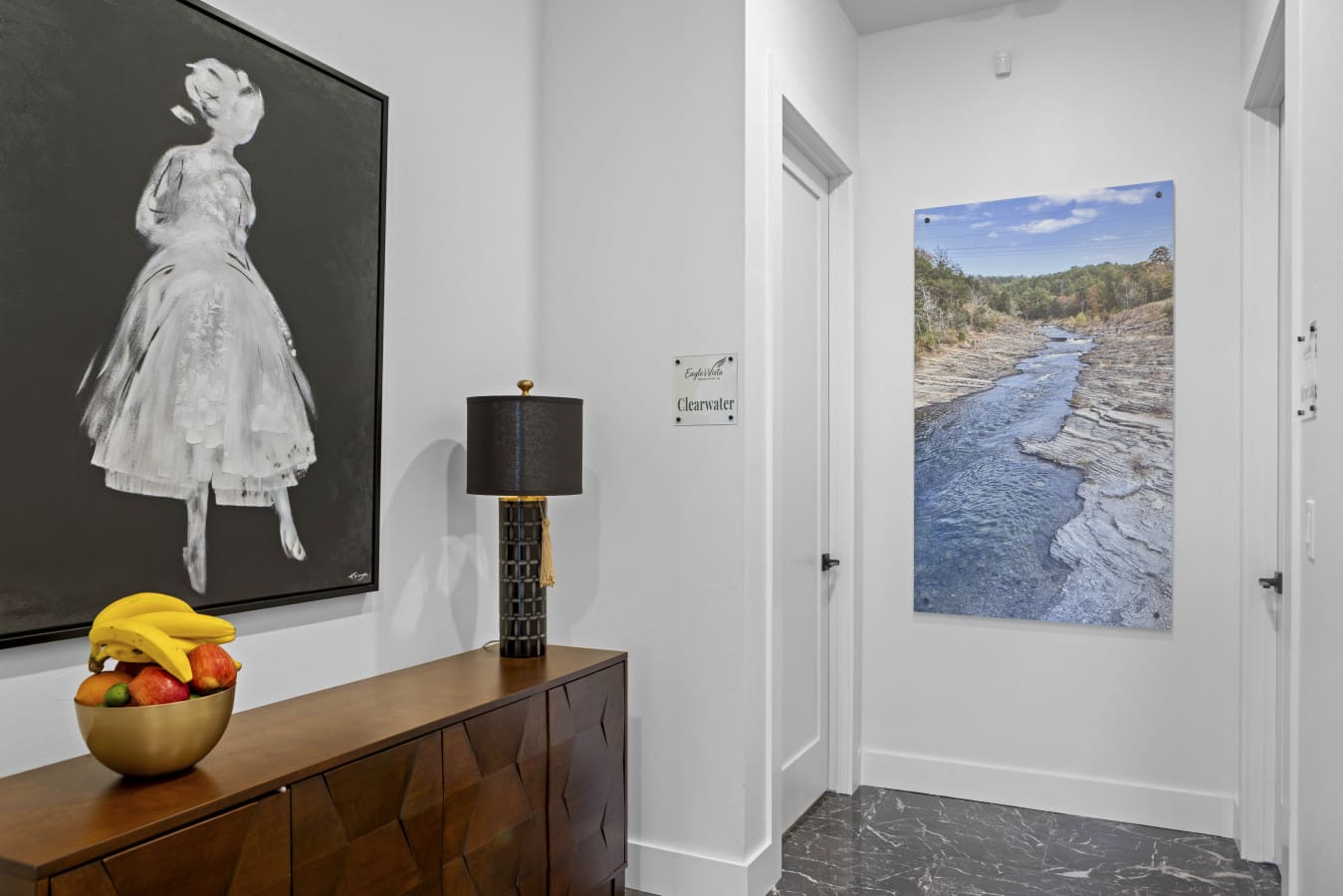 The Clearwater suite welcomes you with moody artwork and a landscape photo of the local creek.