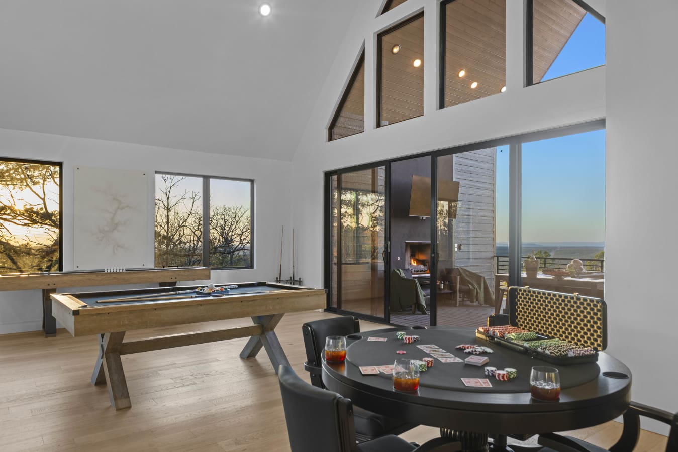 Game room nights at Eagle's Vista mean poker, pool, and the deck fireplace glowing just outside.