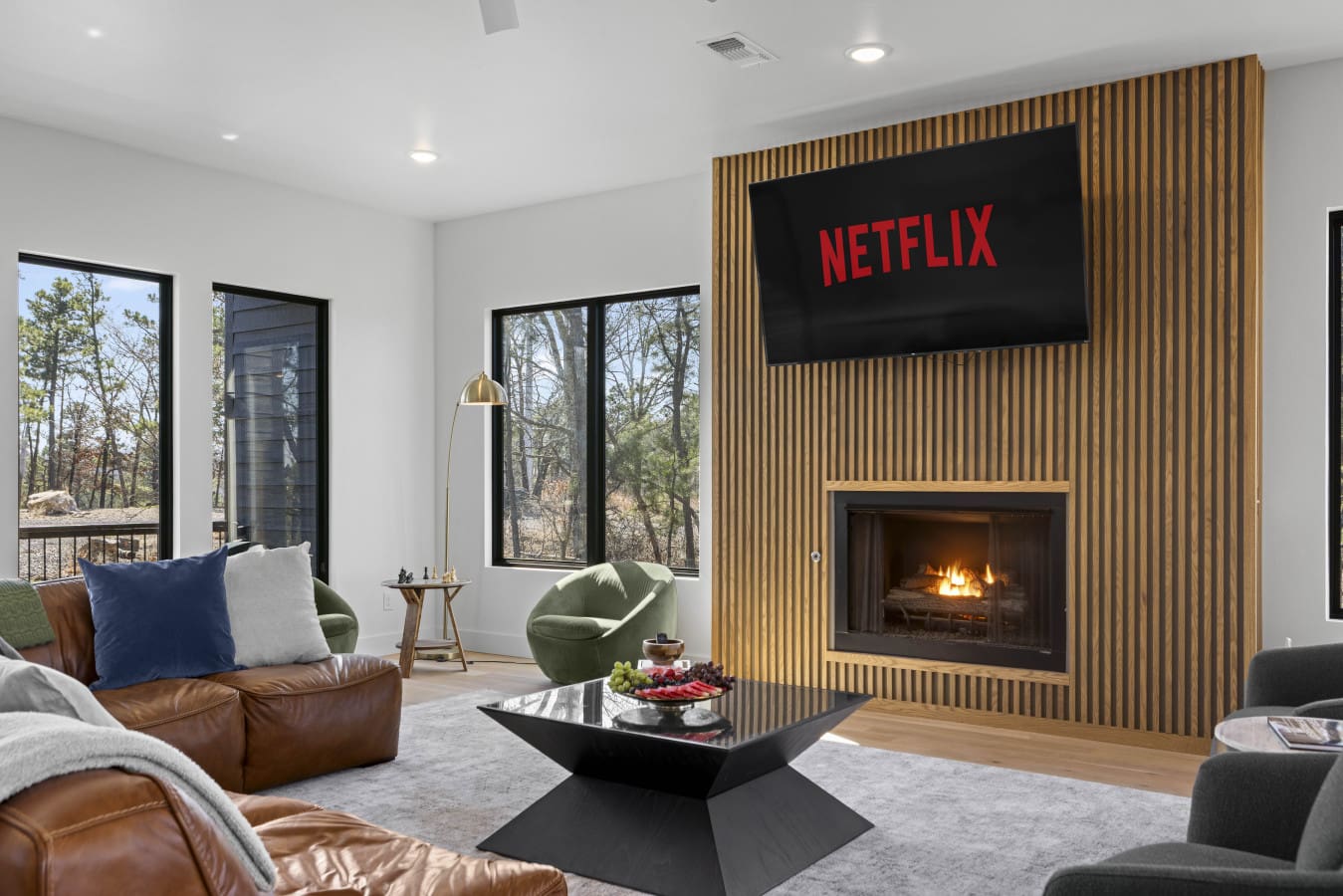 Cozy up by the fireplace with Netflix ready to go — this living room doesn't let you leave.