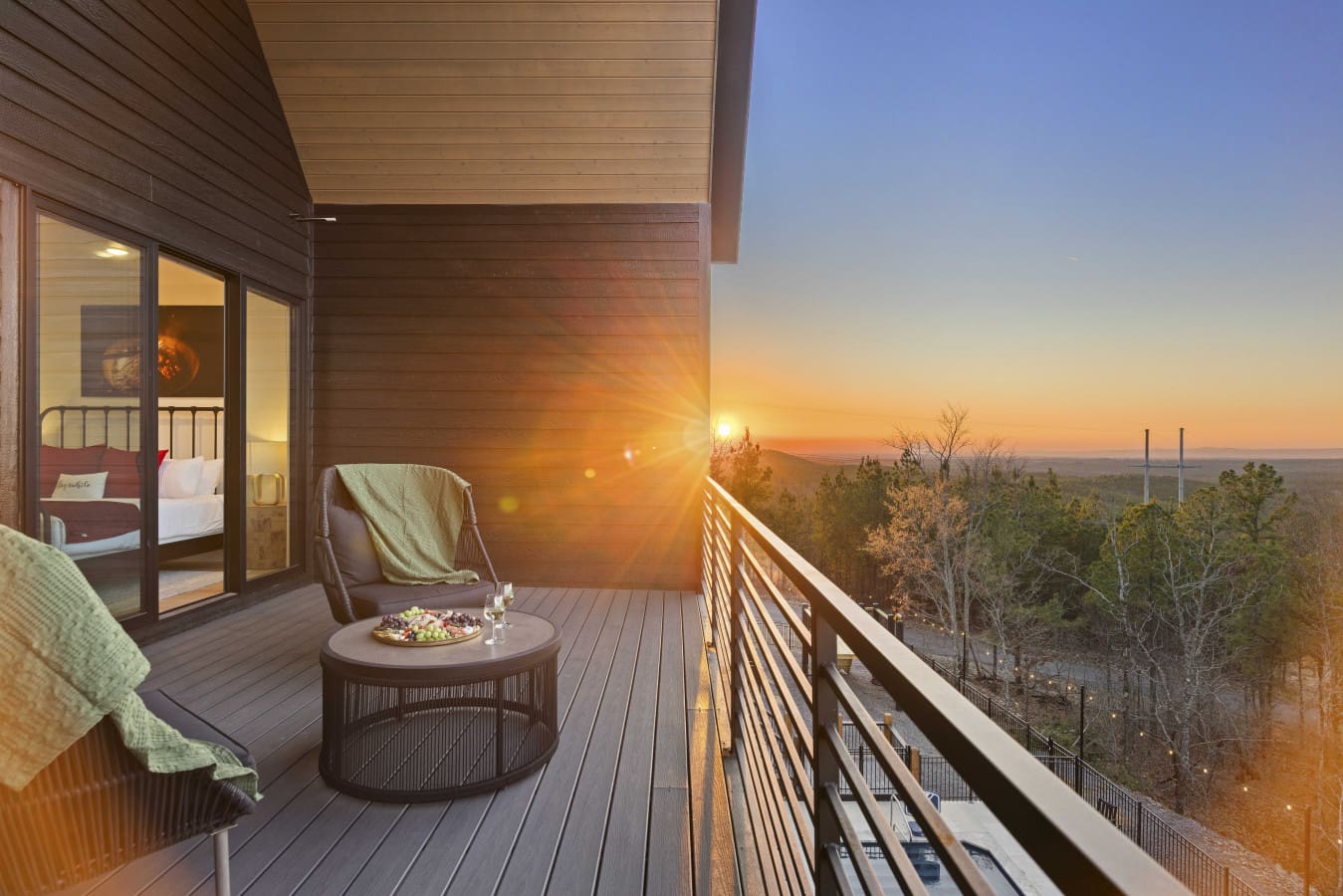 Golden hour on the deck with the Broken Bow treeline stretching out in every direction.
