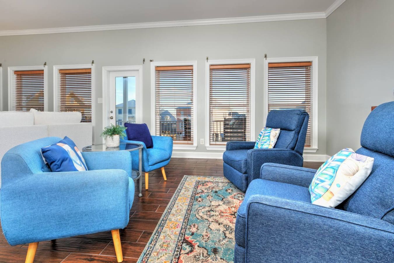 With six sets of those wood-slat doors and windows flooding the room with light, this blue-filled lounge is basically your own private beach club where you can sink into any of these comfy chairs and watch the whole world go by.