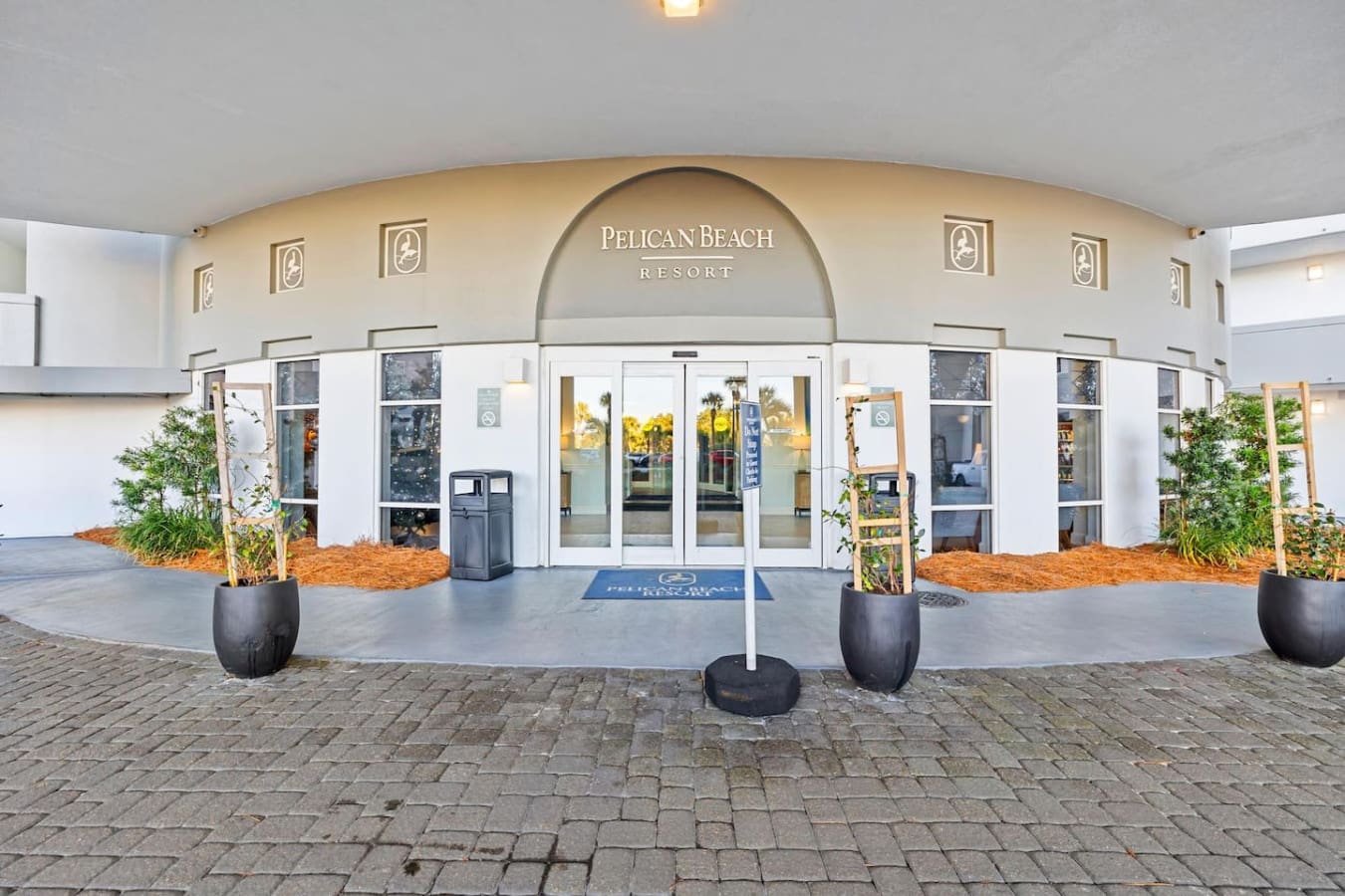 Step through those glass doors and you're basically standing in the heart of Pelican Beach Resort—modern, welcoming, and ready to be your jumping-off point for everything beach.