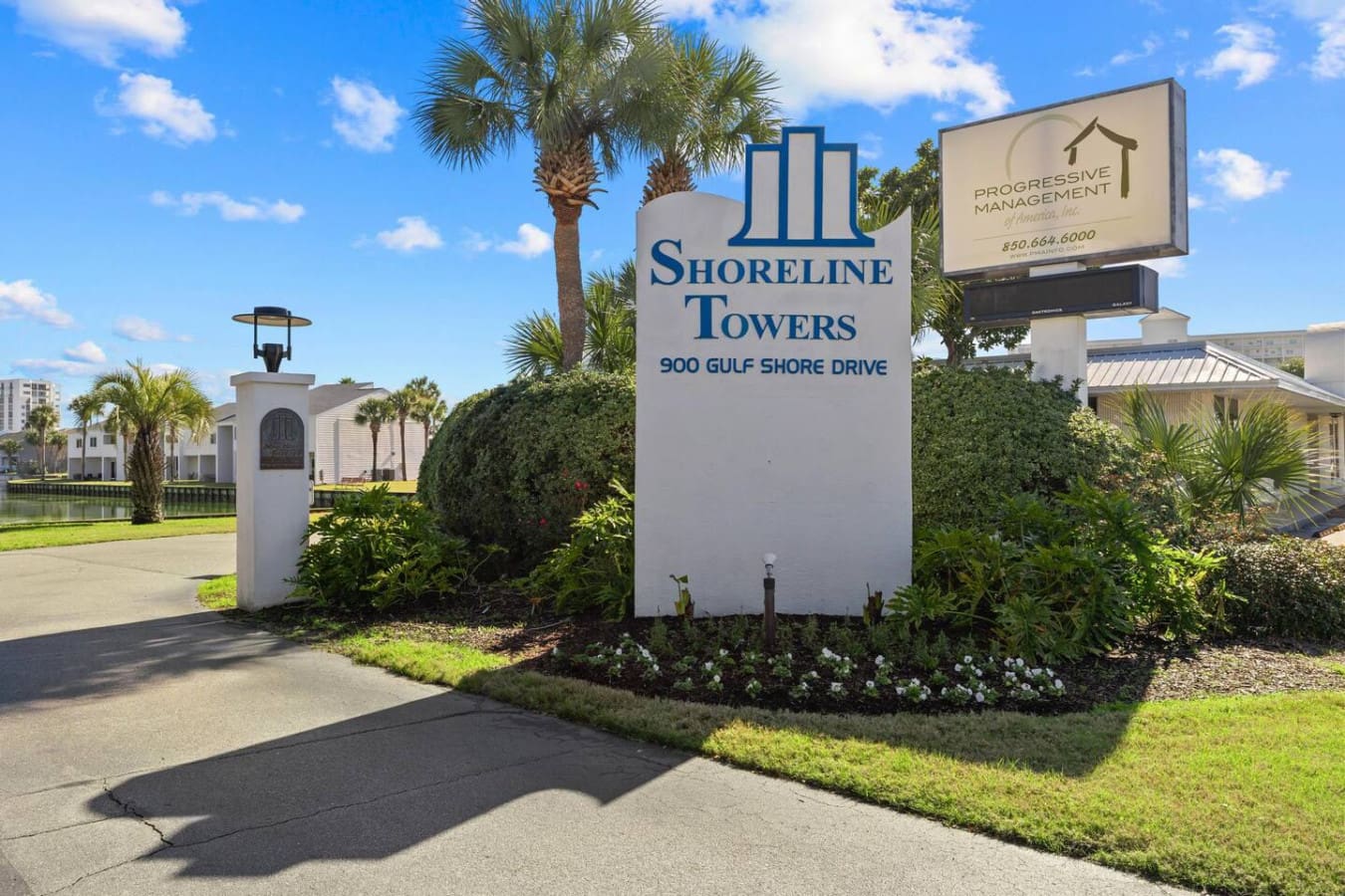 Clear property sign marking the entrance to Shoreline Towers, making it easy to locate.