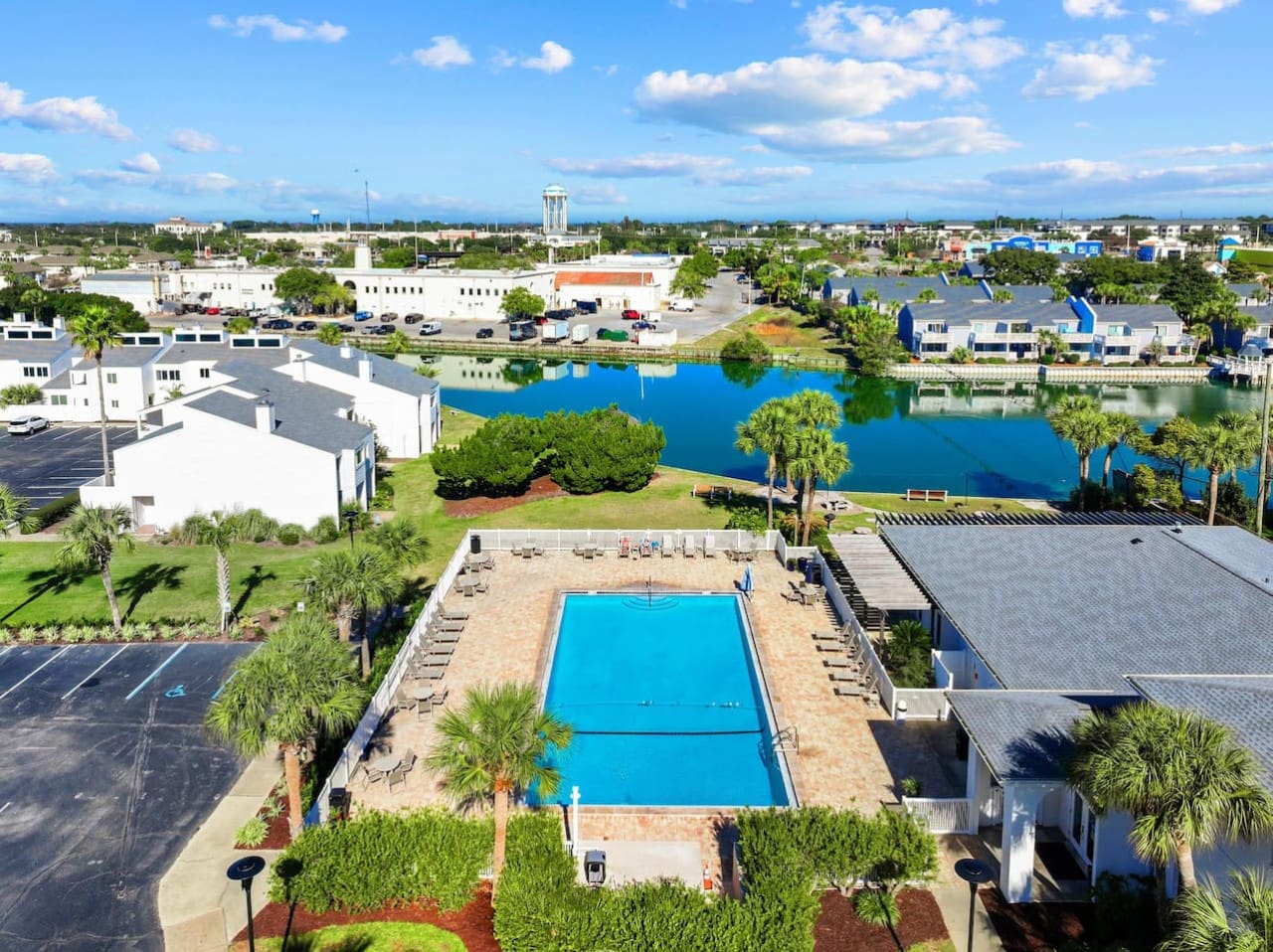 A beautiful aerial pool view showcasing the spacious pool area and surrounding scenery, offering a perfect perspective of the relaxing outdoor oasis below.