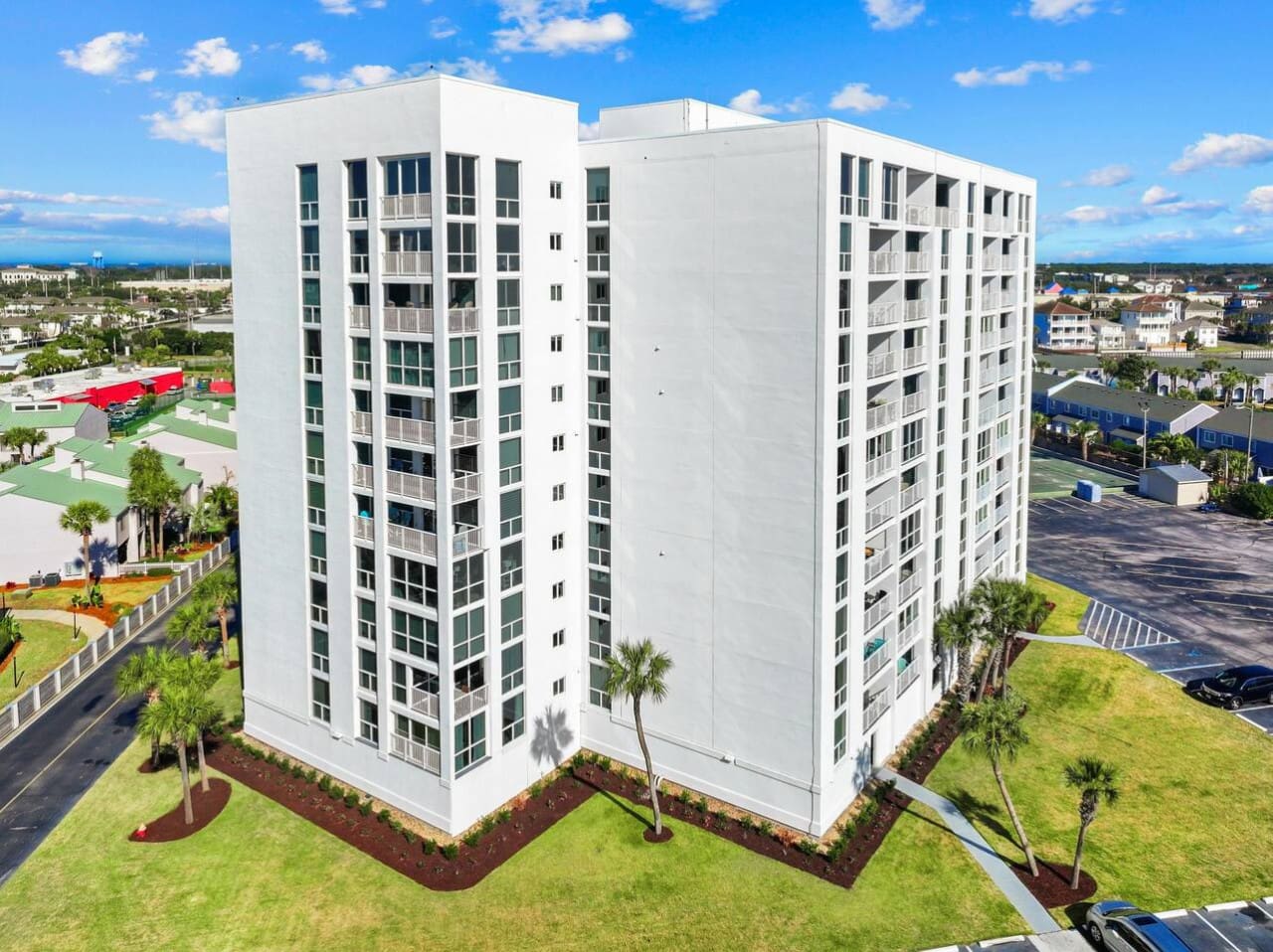 Exterior view of the building, showcasing its structure, coastal design, and welcoming presence at Shoreline Towers.