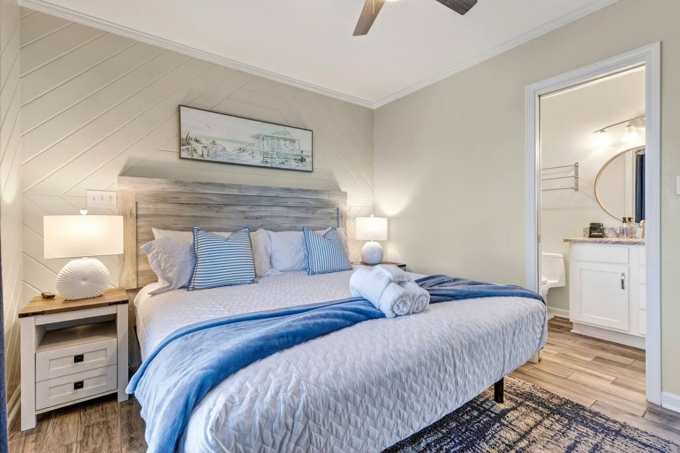 This bright, modern bedroom features a comfy king bed with crisp linens and an ensuite bathroom with all the amenities you need.