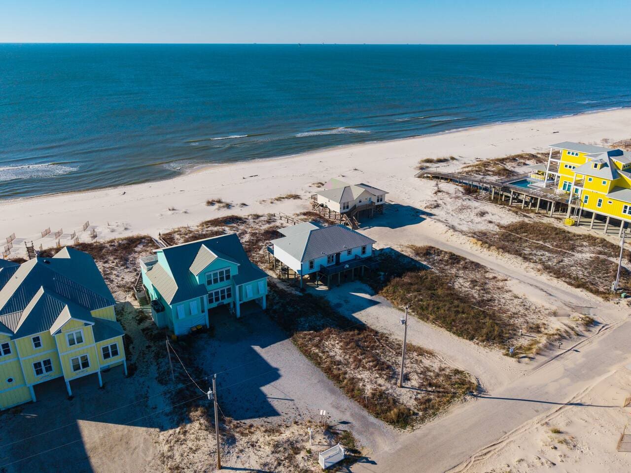 These stunning beachfront homes offer direct ocean access with pristine sand and crystal-clear water right in your backyard.