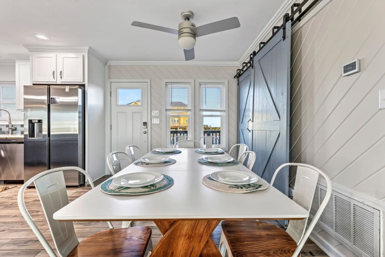 This bright dining area flows seamlessly into the kitchen and opens to stunning ocean views through those gorgeous french doors.