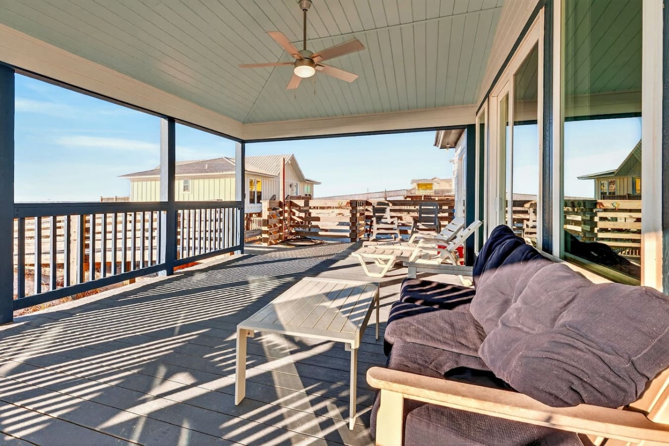 This screened-in porch overlooks the entire ranch with ceiling fans and lounge seating for days.