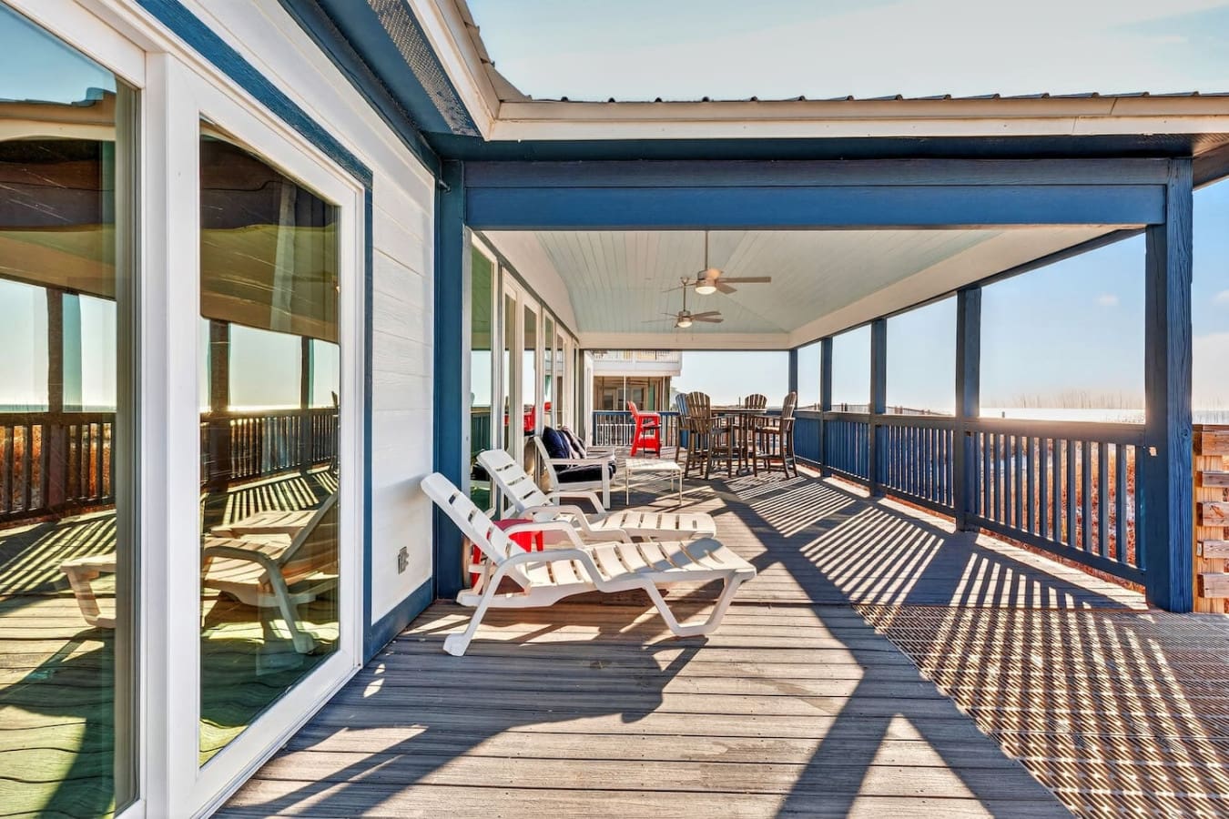 This massive covered deck is basically an outdoor living room with endless sky views and room for the whole crew.