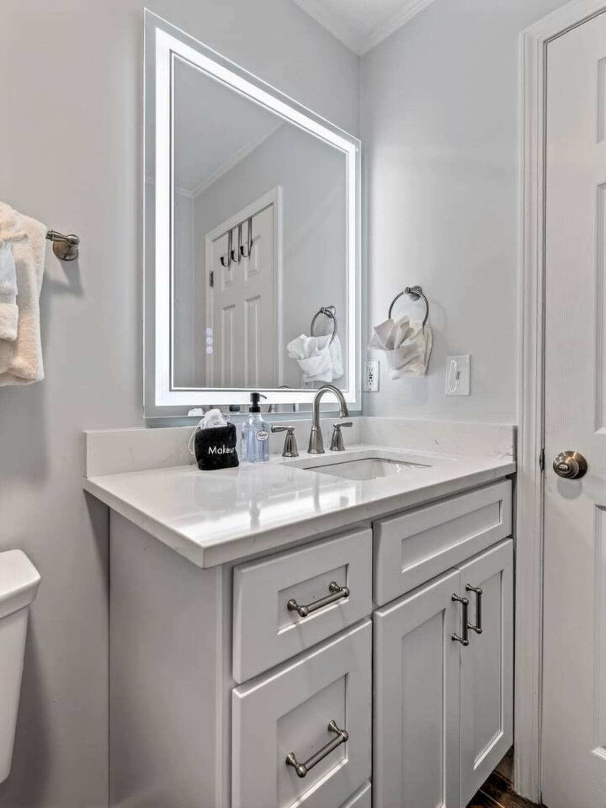 Stunning primary bathroom with LED-lit mirror and spa-like finishes for the ultimate morning routine.