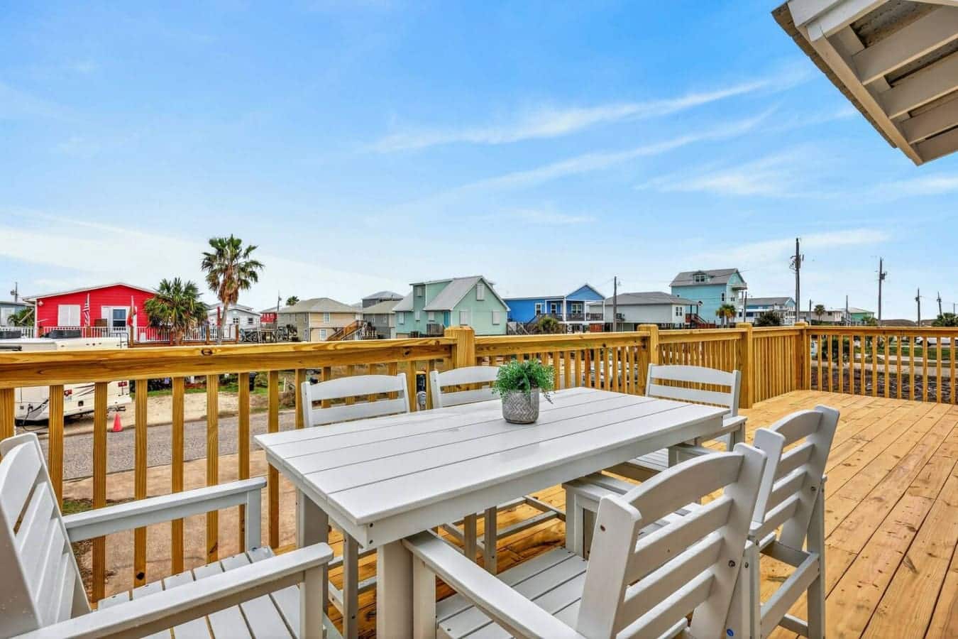 Wake up to this spacious deck overlooking the colorful beachfront community and wide-open sky.