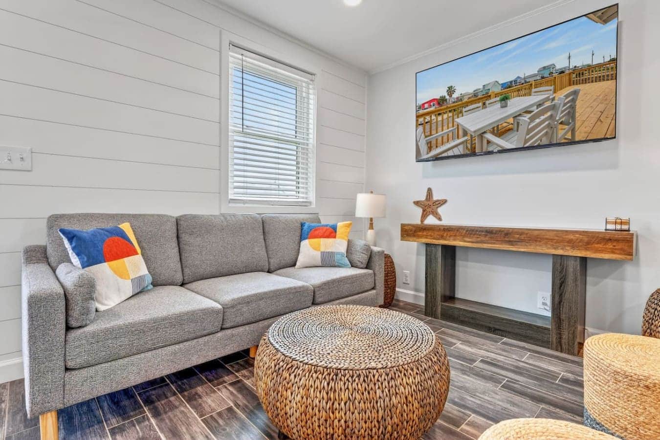 This cozy living room has everything you need to chill out with a view of the beach right from your window.