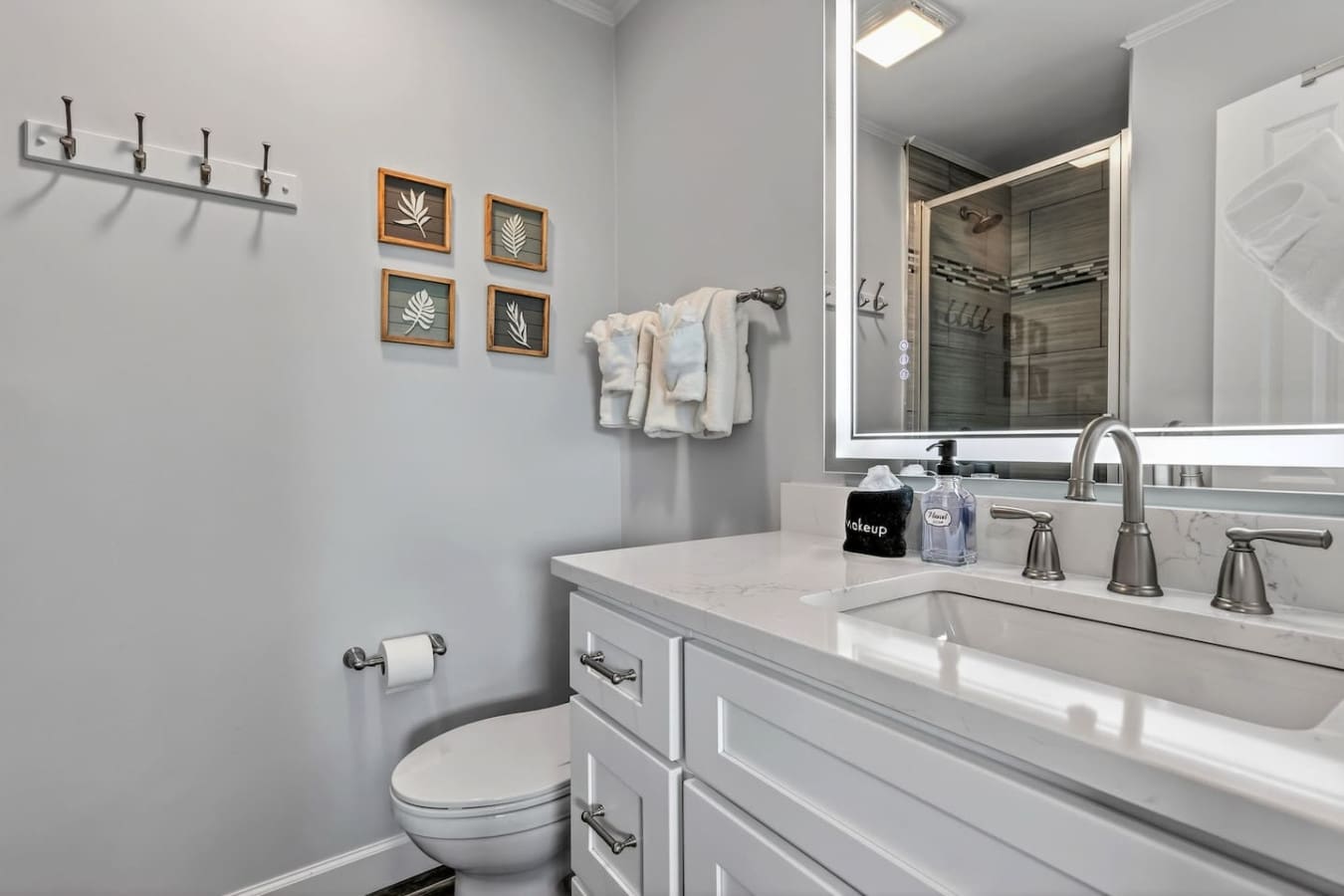 This spa-inspired bathroom features a double vanity, walk-in shower, and elegant finishes perfect for your morning routine.