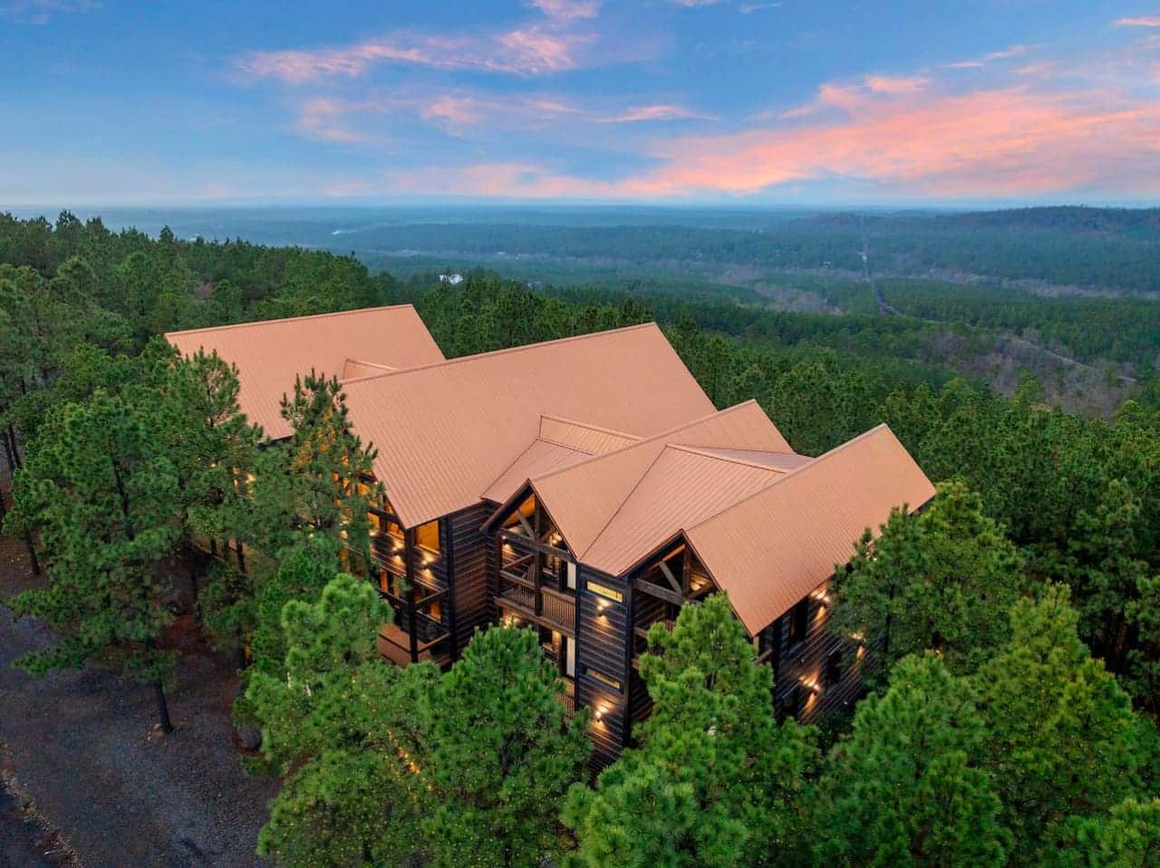 Stunning mountain lodge nestled in the pines with sweeping valley views and that perfect sunset sky.