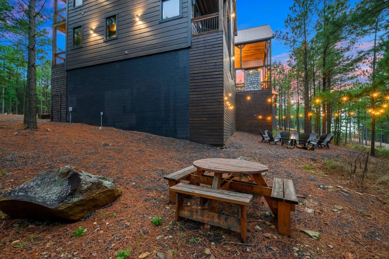 Modern mountain retreat nestled in the pines with a spacious backyard perfect for evening gatherings and stargazing.