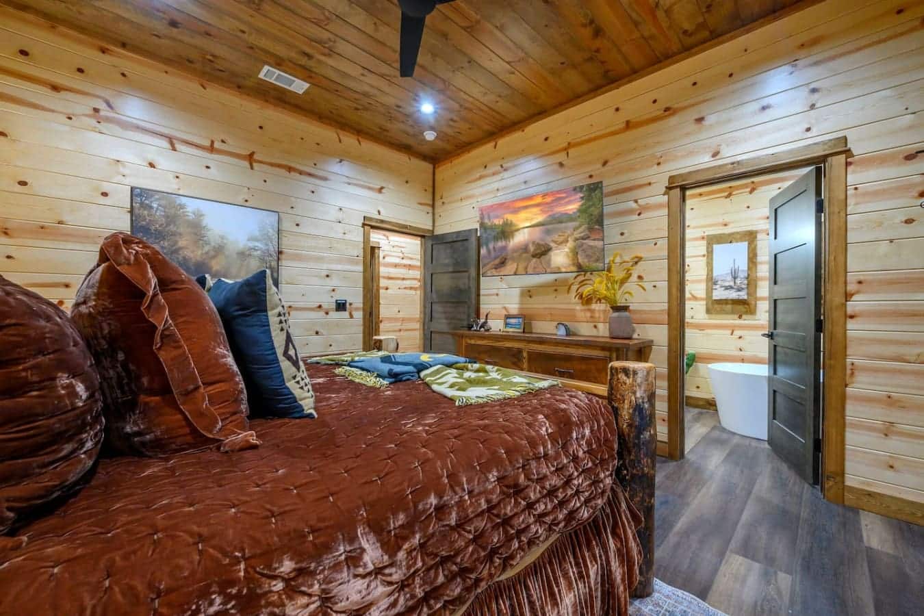 Wake up in this gorgeous log cabin bedroom with those killer sunset views and your own private bathroom attached.