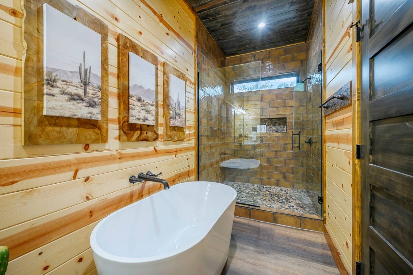 This master bath is an absolute dream with that freestanding tub, huge walk-in shower, and those gorgeous desert landscape views.
