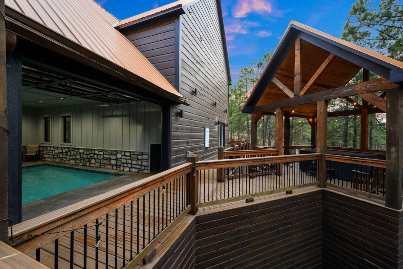 Your own private indoor pool with covered deck space and forest viewsu2014basically every outdoor living dream in one spot.