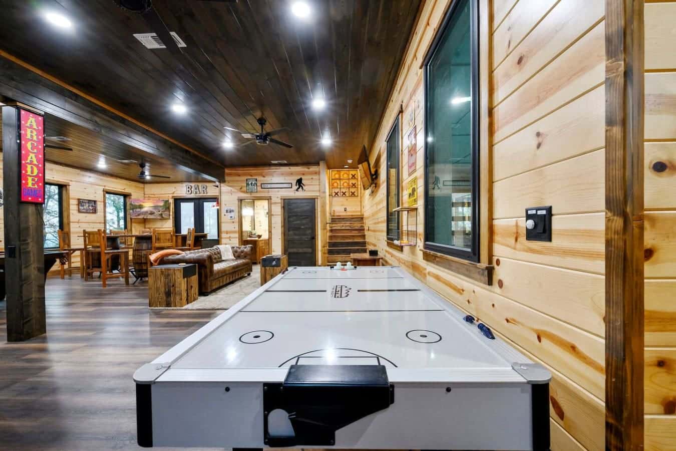 This game room has everything you need to keep entertained—air hockey, arcade games, and plenty of space to hang out.