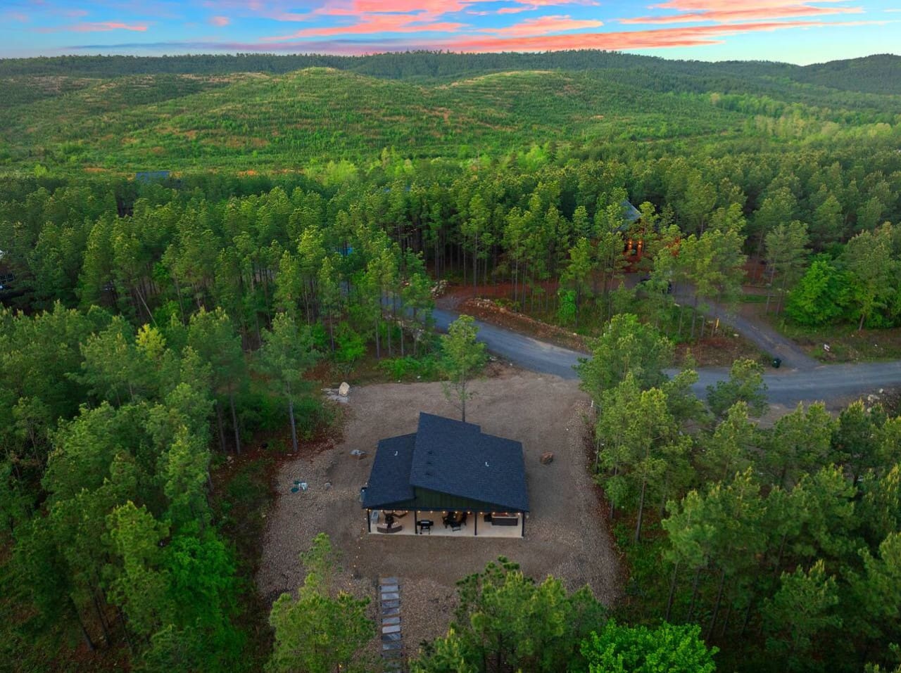 Imagine having your own modern cabin completely tucked away in the middle of endless pine forest with a river winding through the trees—this is basically what living off the grid actually looks like.