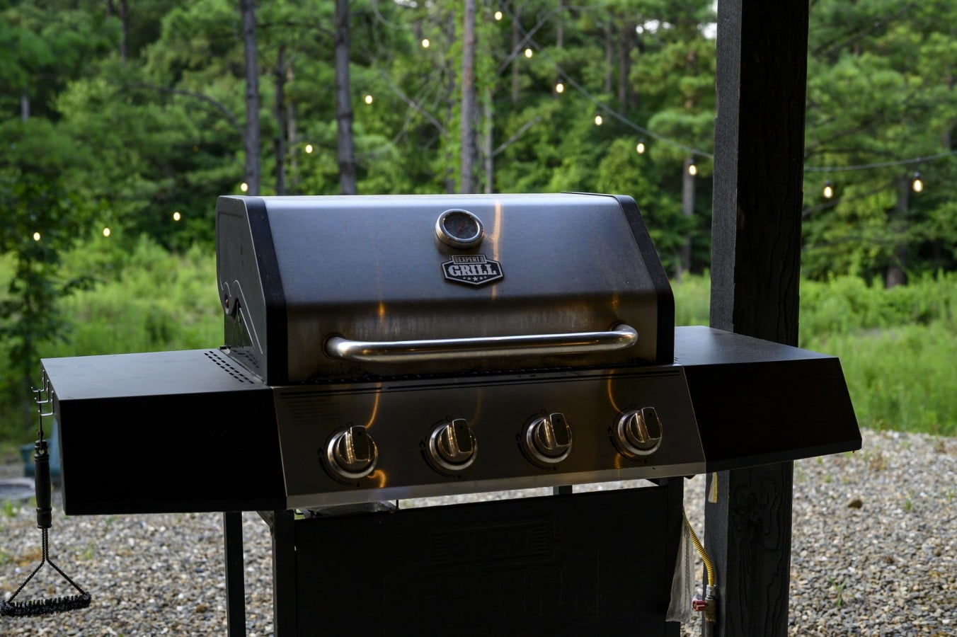 Grill station positioned on the covered patio for convenient outdoor cooking.