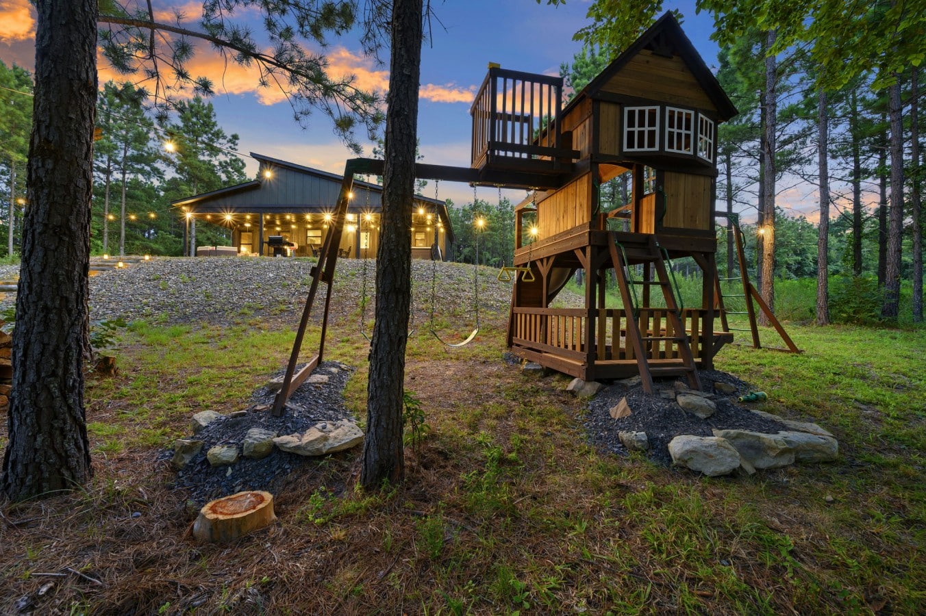 Swing set and outdoor play area beside the cabin.