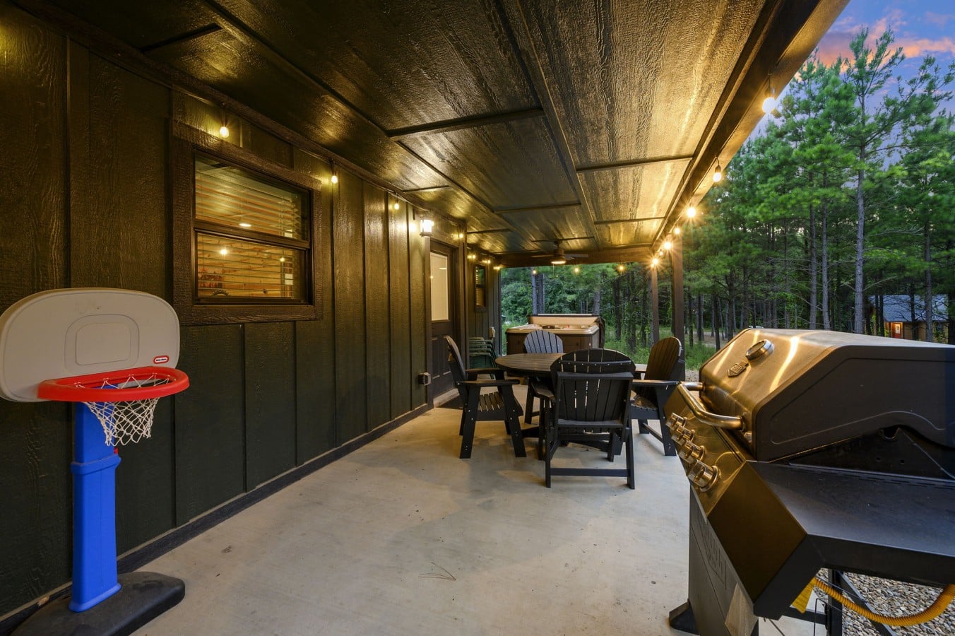 Arcade-style basketball game adds extra fun to the covered patio.