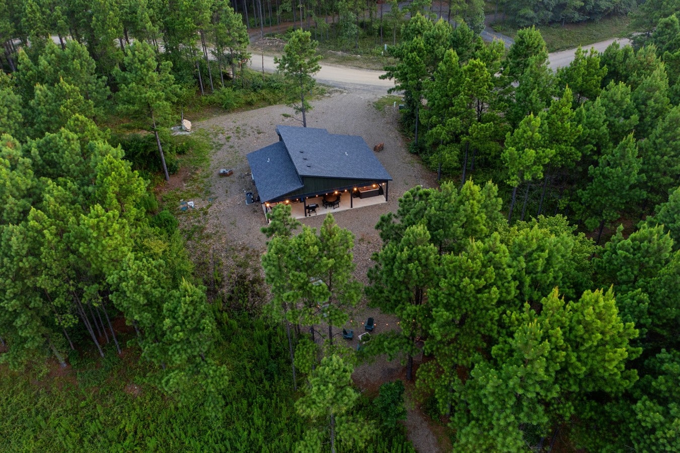 Drone view of the cabin tucked into a private forest lot.