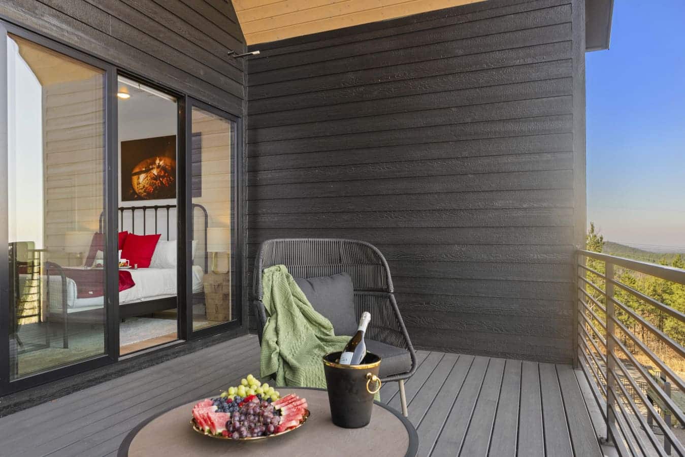 This bedroom deck looks out over the pines — made for slow mornings and doing absolutely nothing.