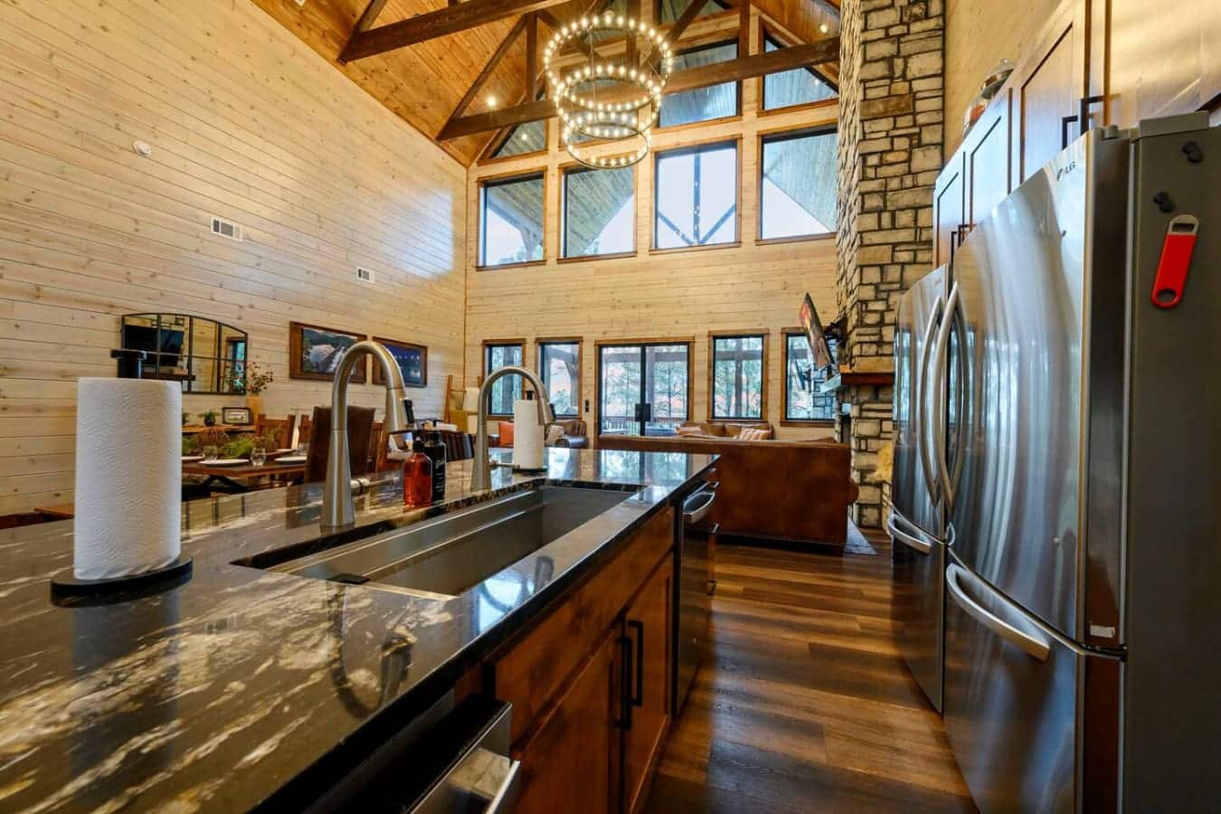 This gorgeous kitchen features soaring timber ceilings, premium stainless appliances, and tons of natural light from every angle.