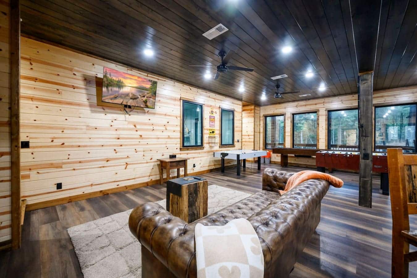 This spacious lodge game room has everything you need to keep everyone entertained with foosball, pool, and gorgeous views.