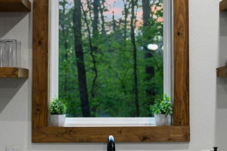 Wake up refreshed in a comfortable bedroom overlooking the water.