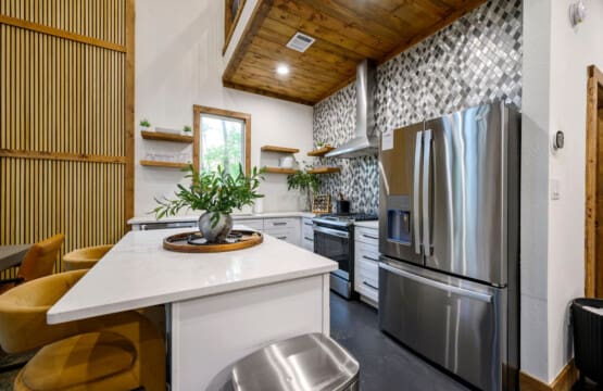 The well-equipped kitchen makes meal prep a breeze in your serene retreat.