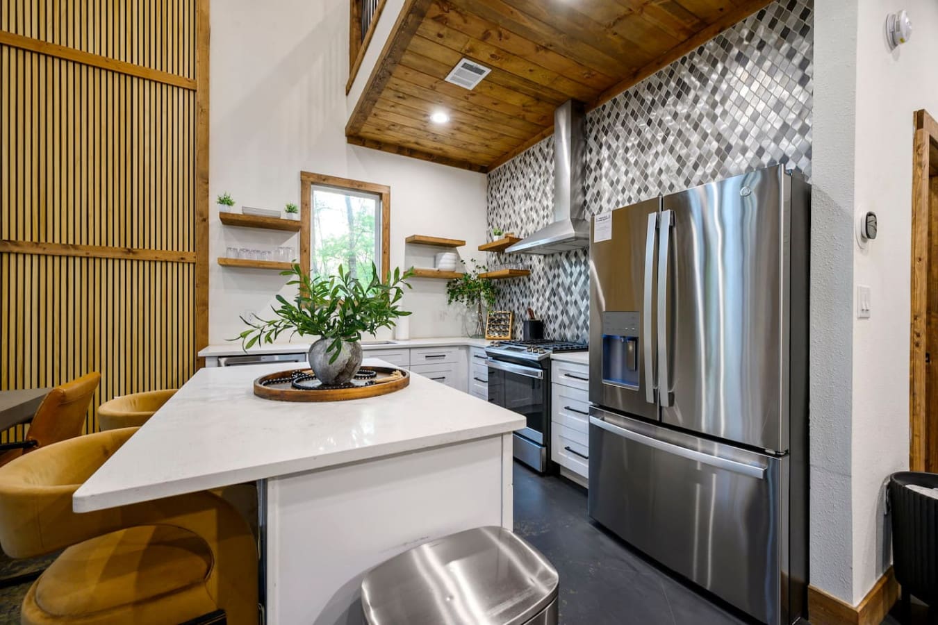 The well-equipped kitchen makes meal prep a breeze in your serene retreat.