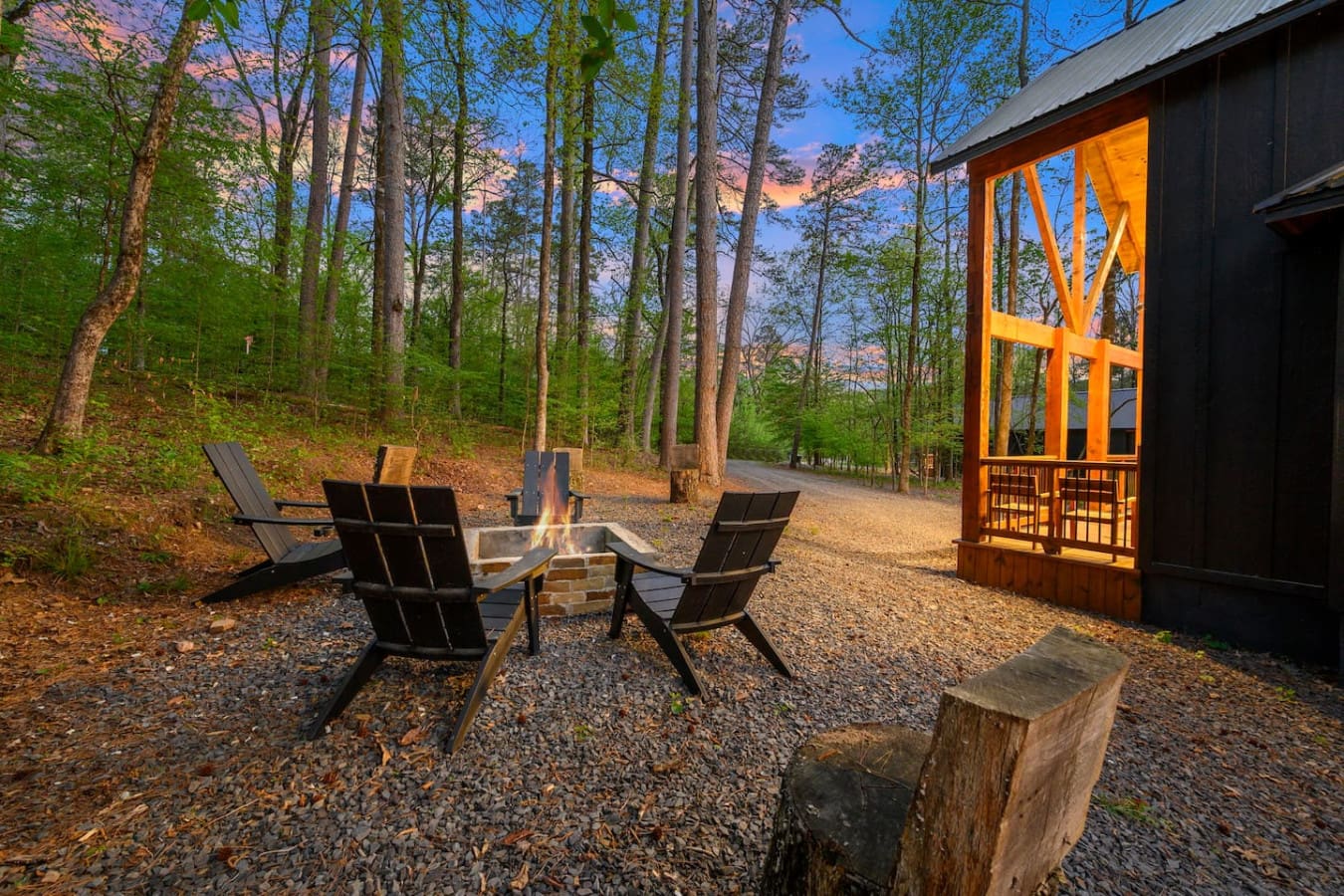 This inviting cabin deck offers peaceful views of the tranquil pond.