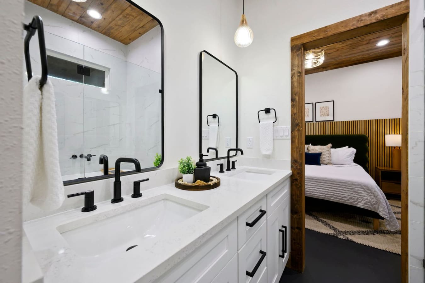 The modern bathroom features a spacious shower and elegant finishes.