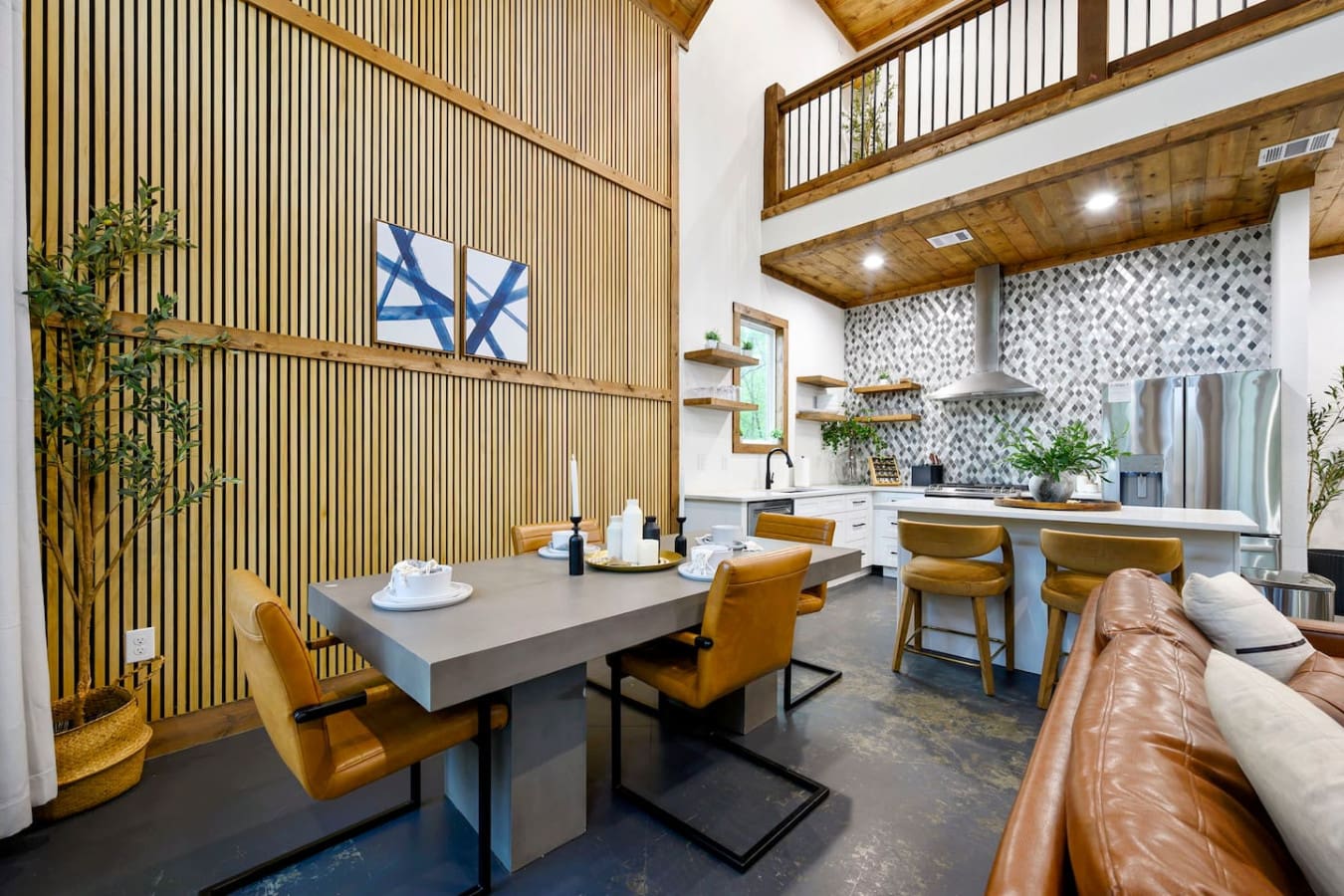 This inviting cabin deck offers peaceful views of the tranquil pond.