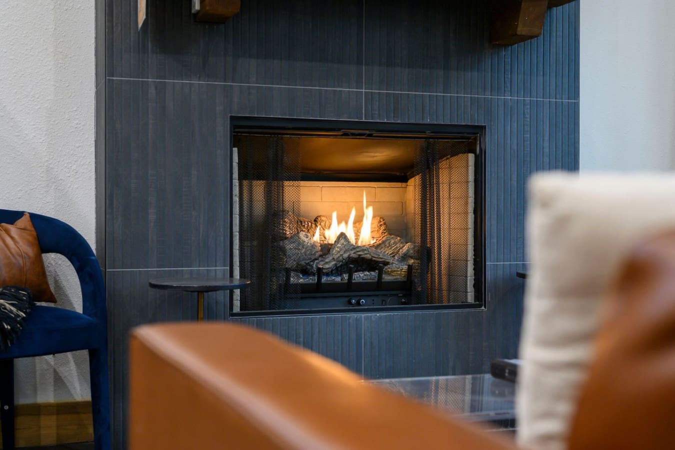 This inviting cabin deck offers peaceful views of the tranquil pond.