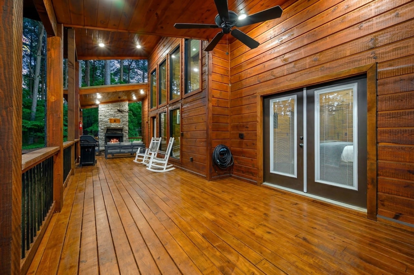 Rocking chairs, a roaring fireplace, and a grill-ready deck — outdoor living perfected.