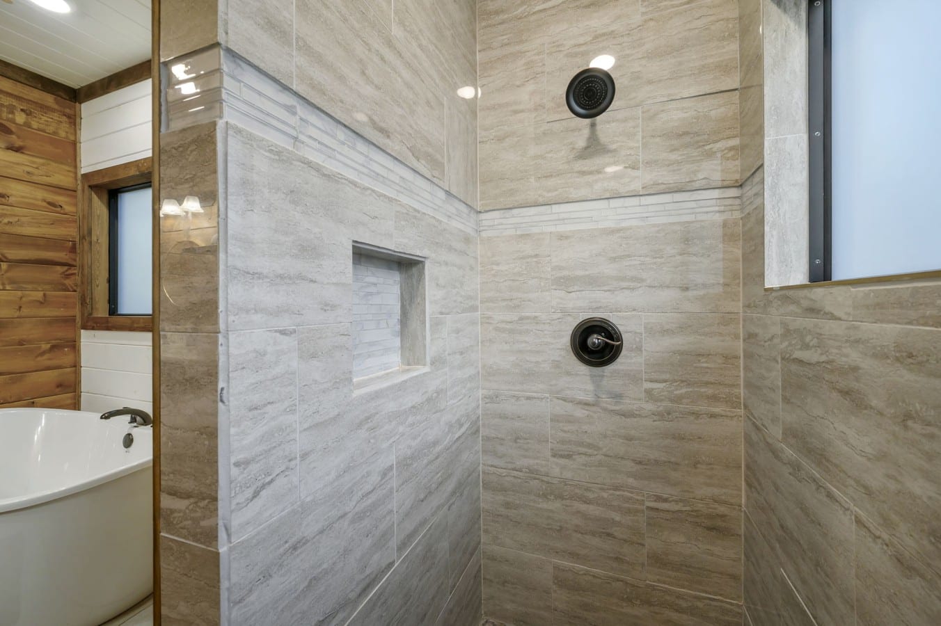 Choose your wind-down ritual — rainfall shower or deep soak — either way, you win.