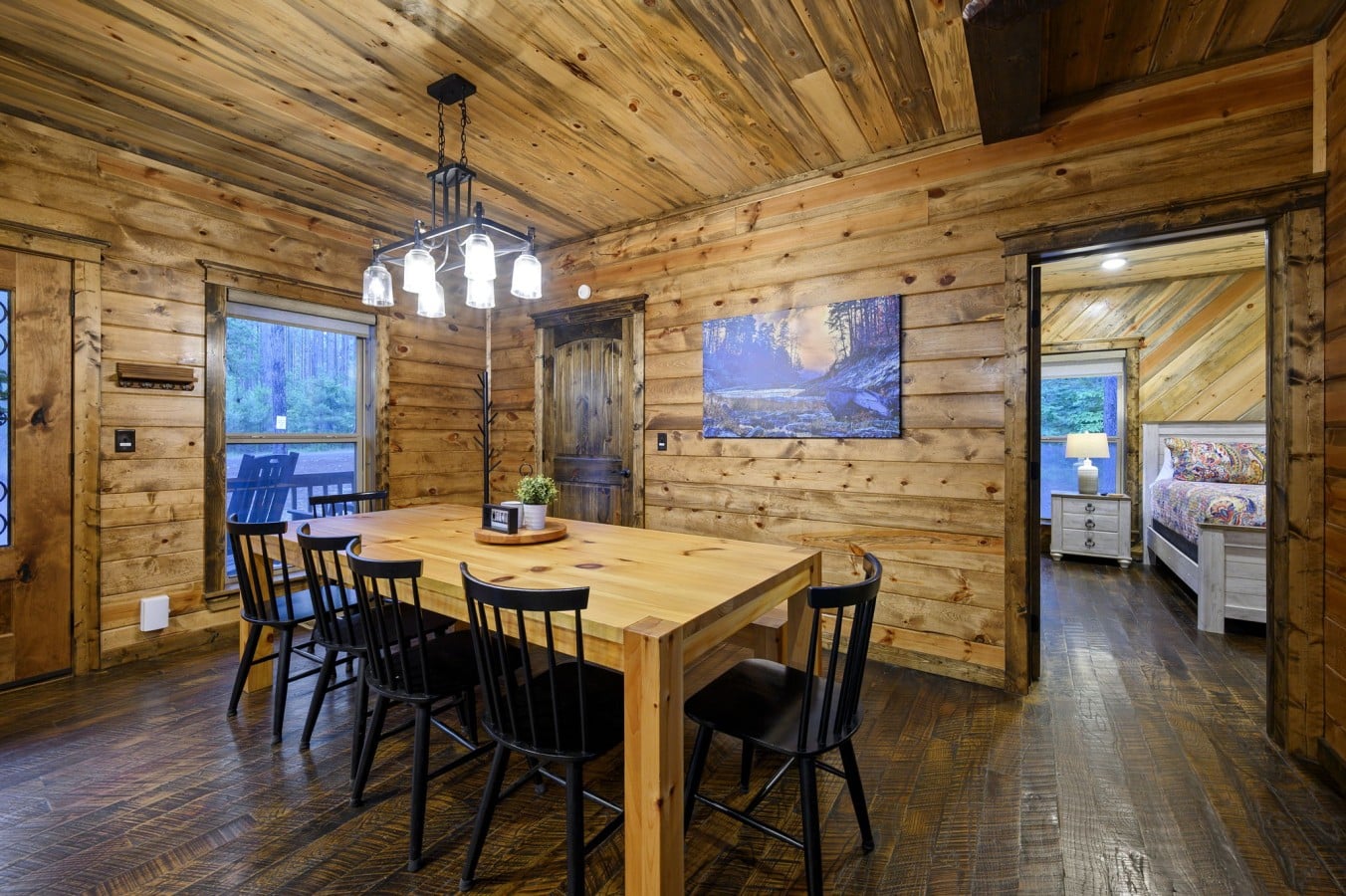 Rustic pine walls and a well-set farmhouse table make every meal feel like a proper celebration.