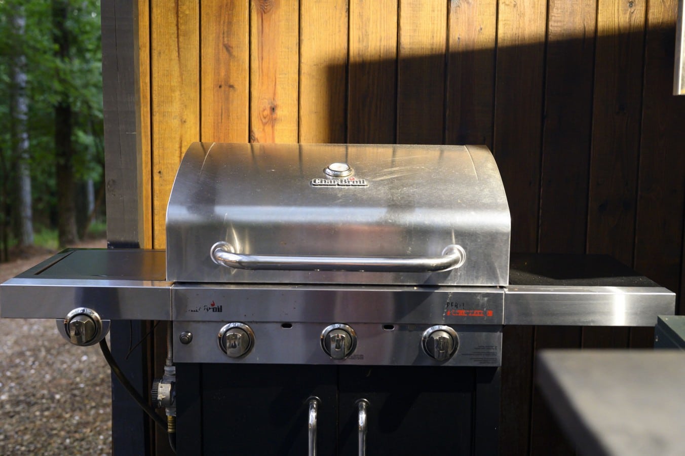 Fire up the four-burner gas grill and make every dinner an outdoor feast in the trees.
