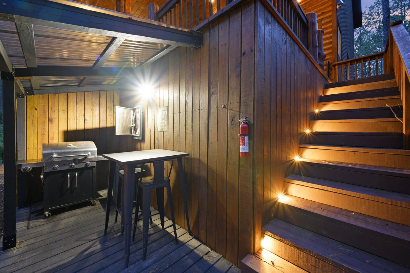 Grill under the stars from a covered outdoor kitchen designed for effortless entertaining.