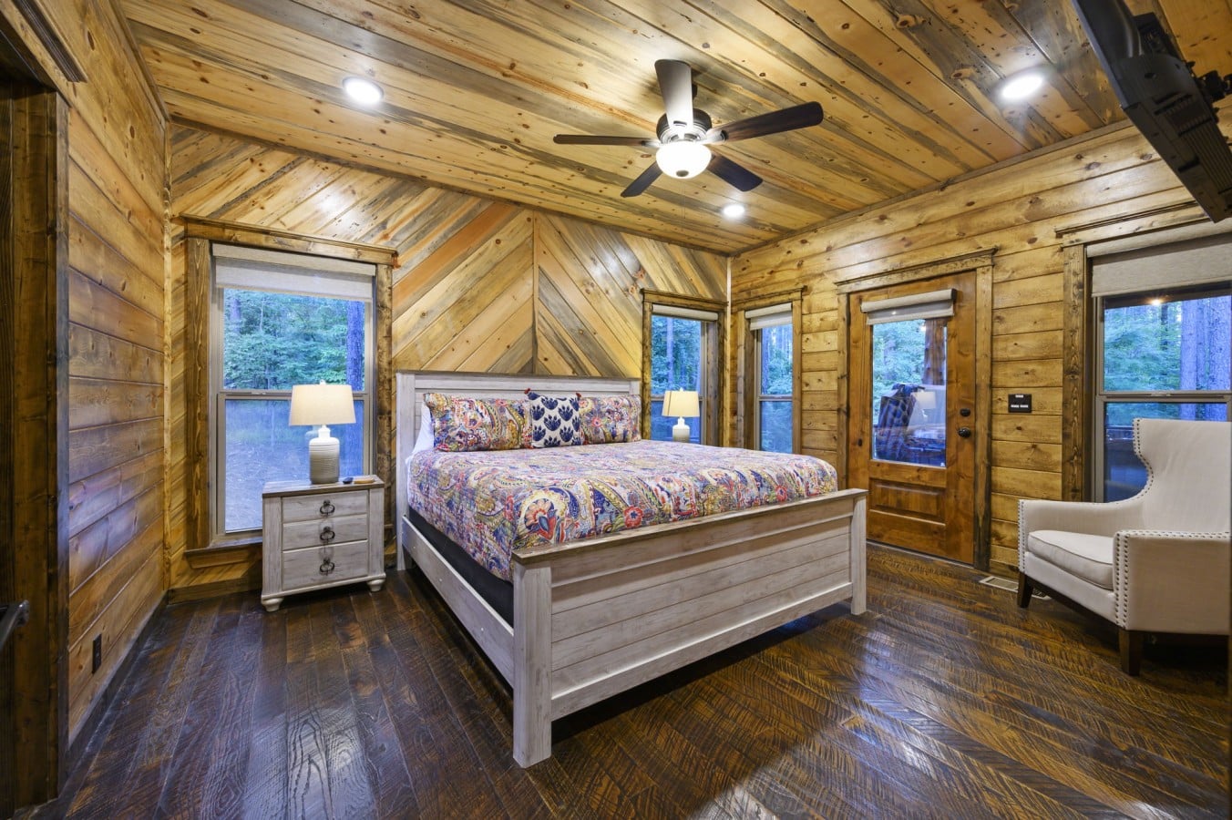 Drift off under a vaulted wood ceiling while twilight filters through forest windows.