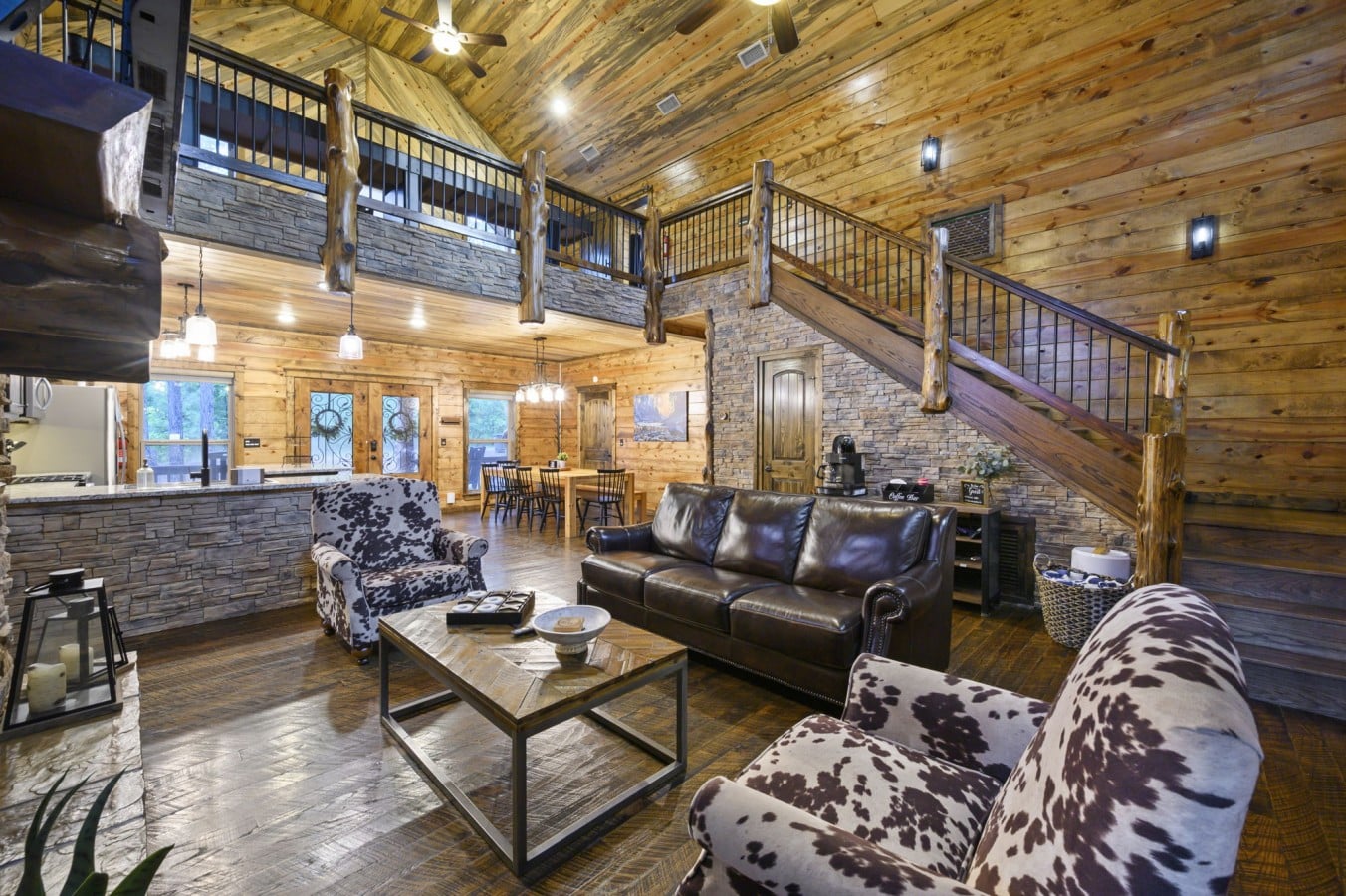 From the coffee bar to the cowhide chairs, every corner of this living room is crafted for comfort.