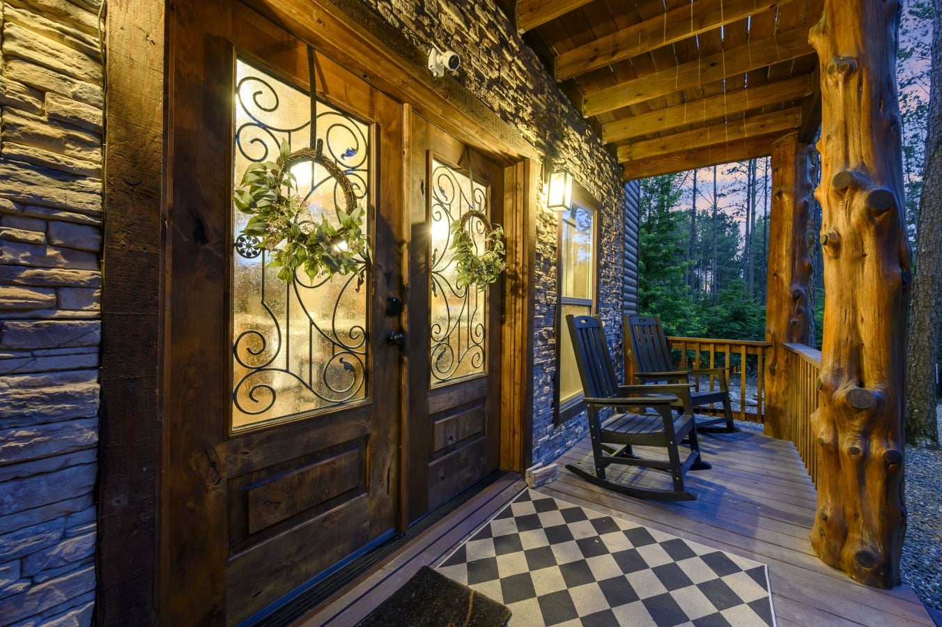 Wreath-adorned entry doors and rocking chairs make a first impression that never gets old.