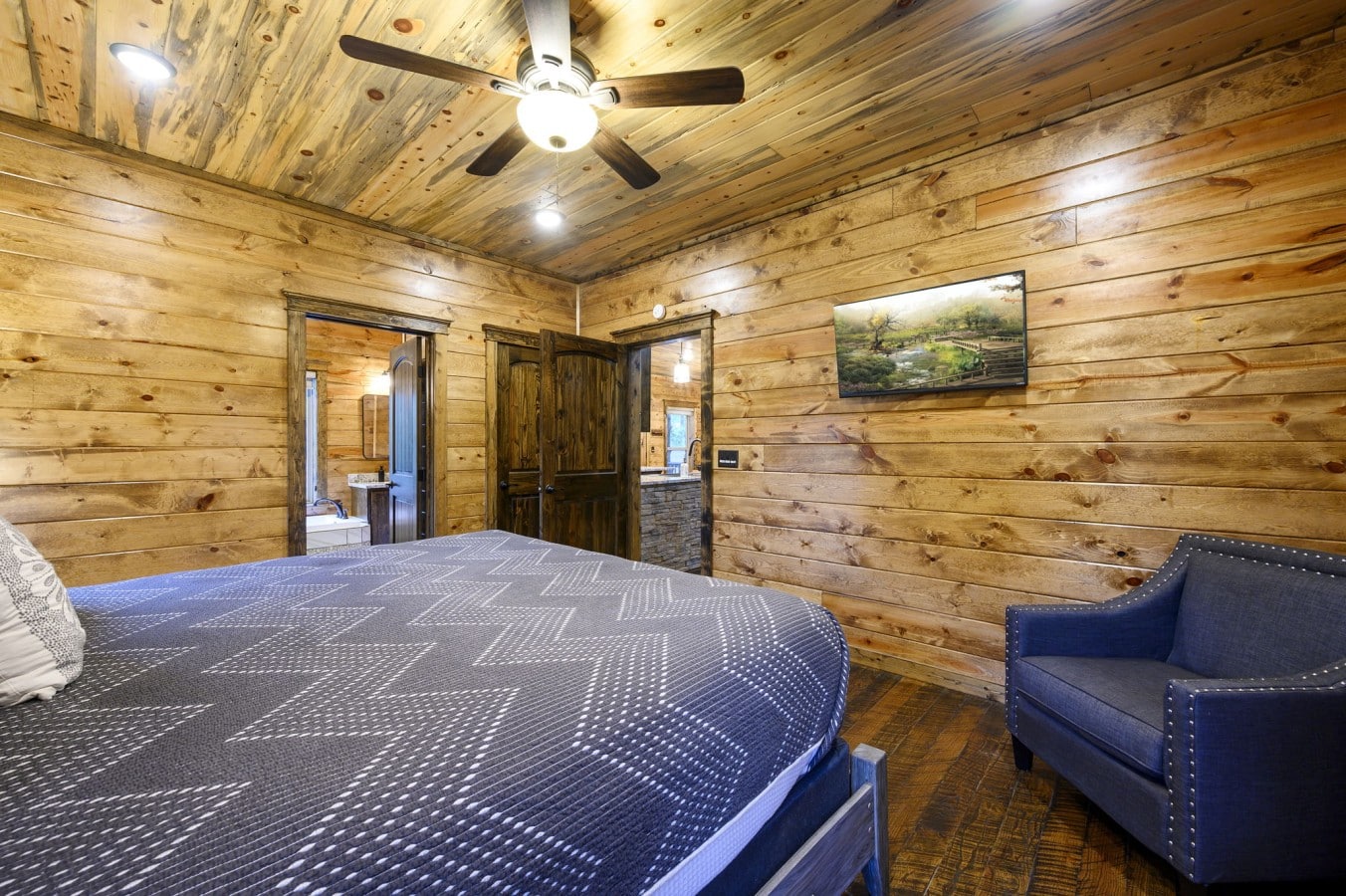 A spacious king suite with en-suite access gives couples their own private cabin sanctuary.