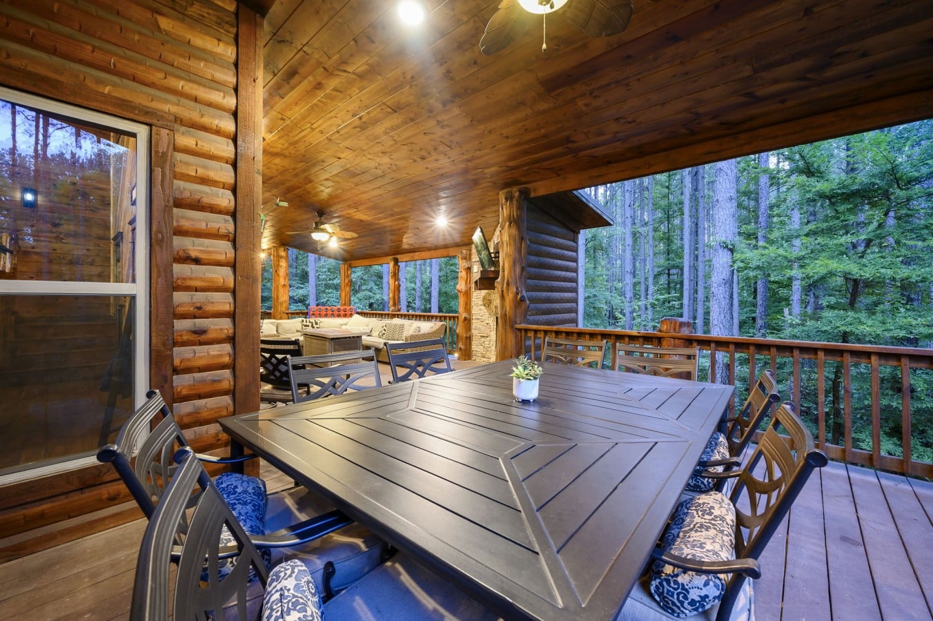Dine al fresco at the long deck table while the forest hums softly all around you.